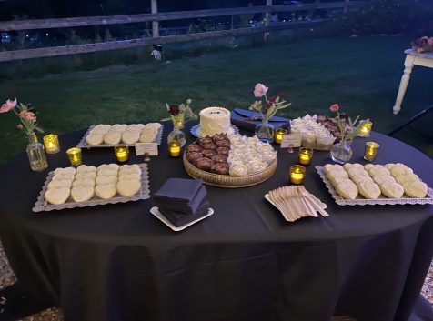 Beautiful dessert table with assorted sweets arranged outdoors at a wedding in Leavenworth, Washington.